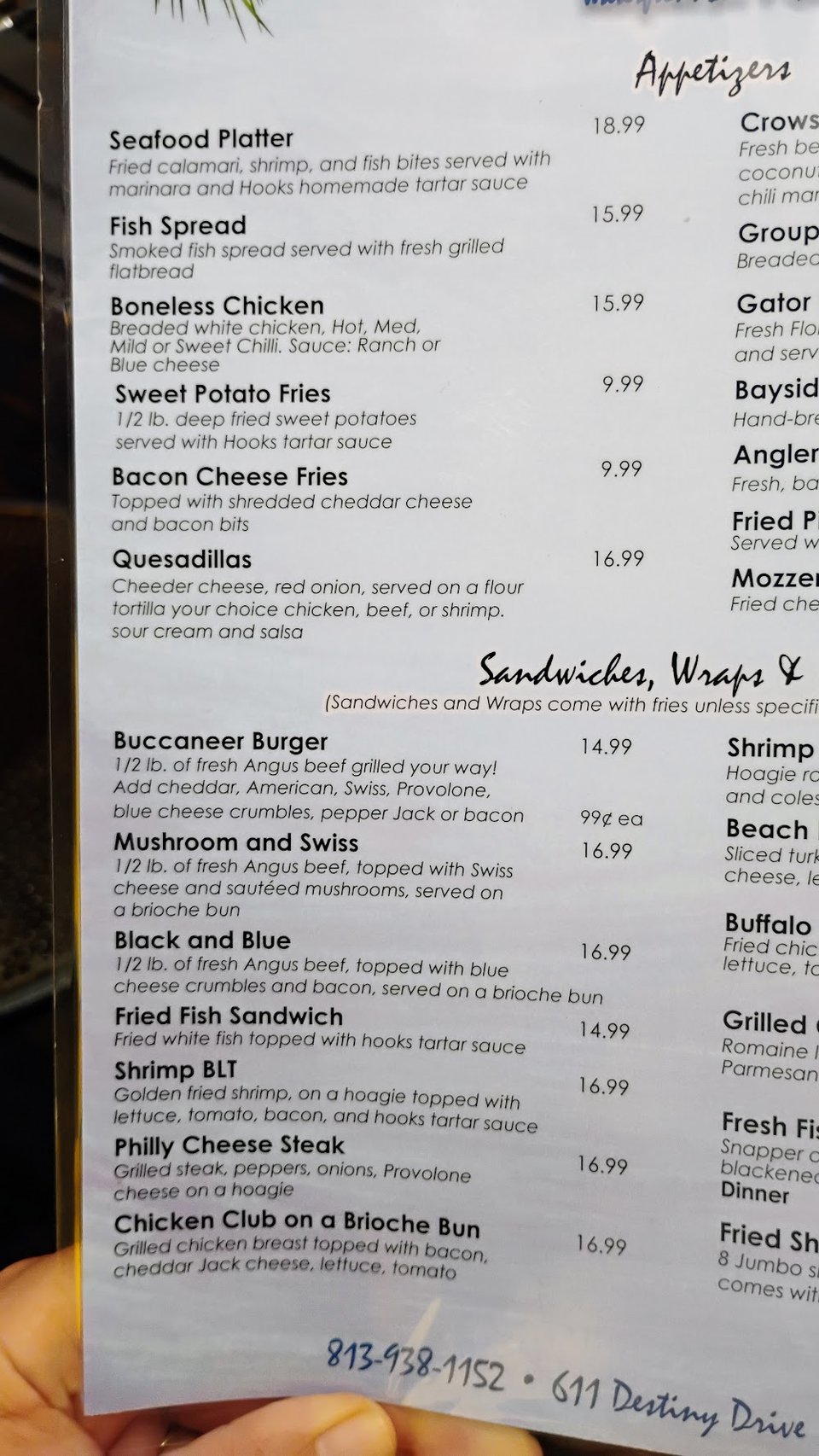 Menu page showing burgers and seafood dishes.