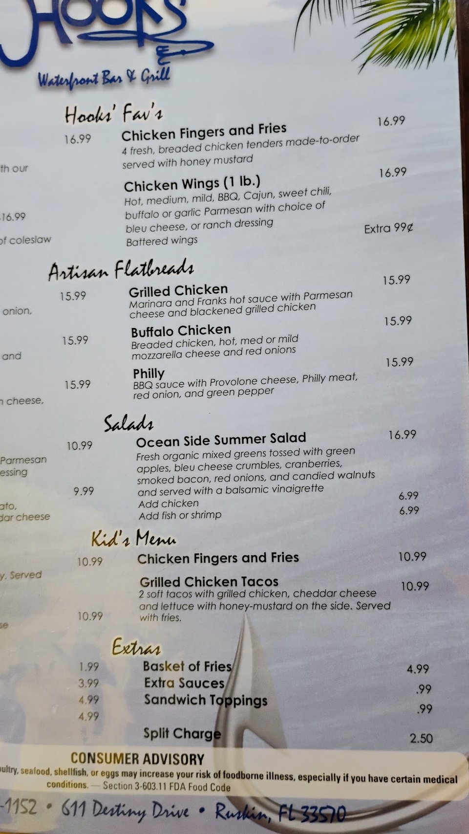 Printed menu with sandwiches, salads, and tacos.