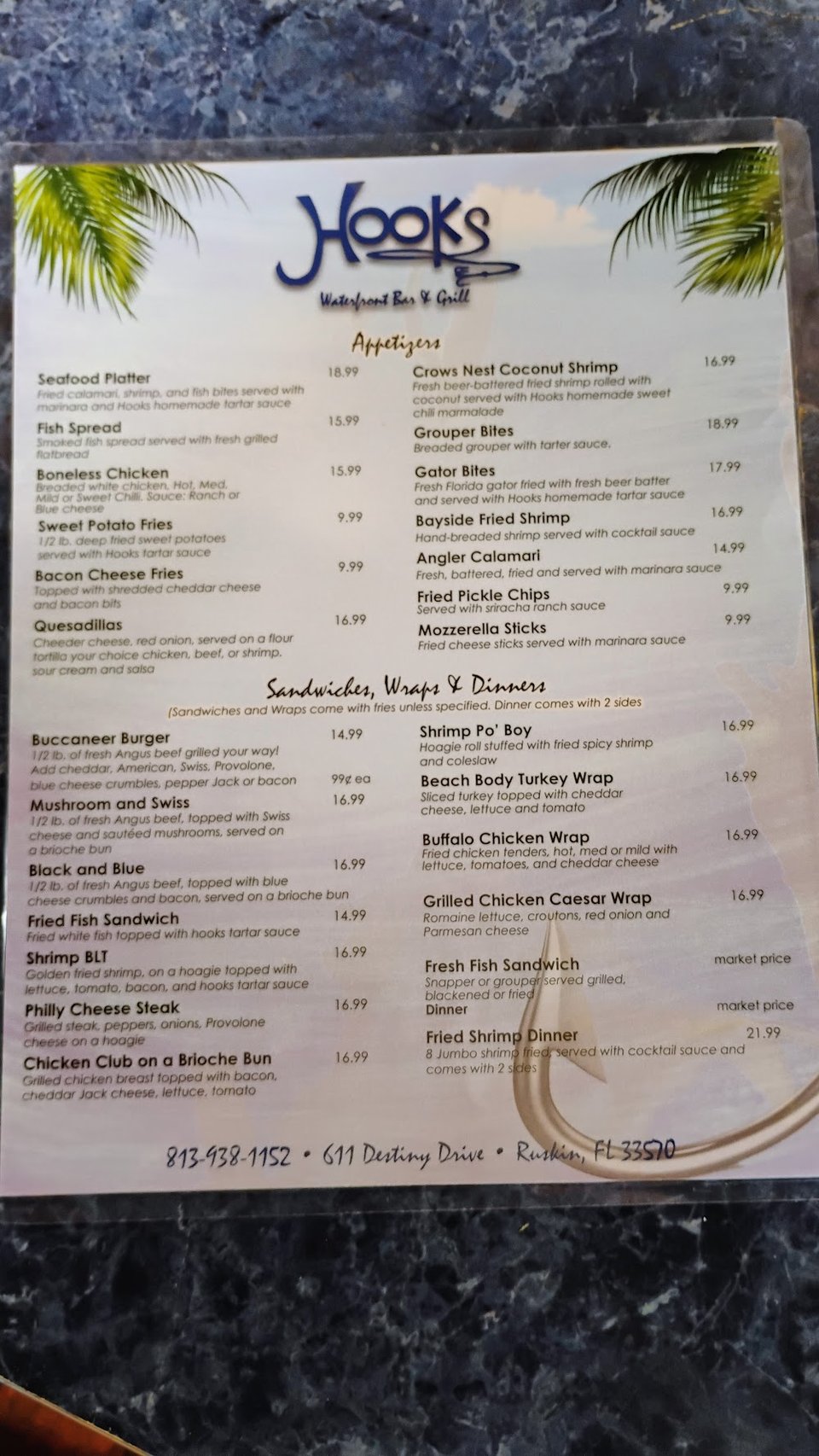 Food menu with fish, burgers, and sides.